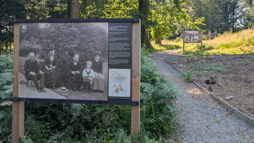 Interpretation panel from the Pages from the Potter Family Album outdoor exhibition at Wray, featuring a large historic black-and-white family photograph.